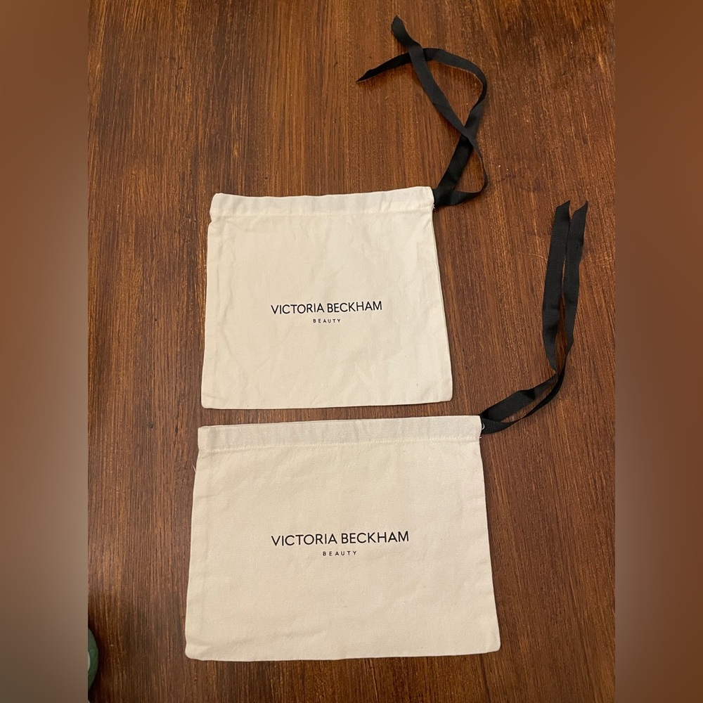 Set of 2 Victoria Beckham Beauty Cream Cosmetic Pouches.